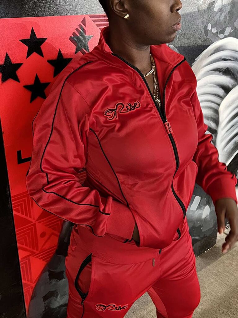 Woman’s Dripping Red tracksuit, black piping with custom rubber logo